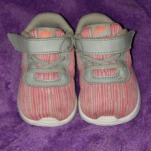 Cute pair of pink and gray Nike tennis shoes!!